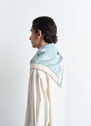 Philippe weisbecker silk square 90 in green dry silk, model shot, side view soft hand texture