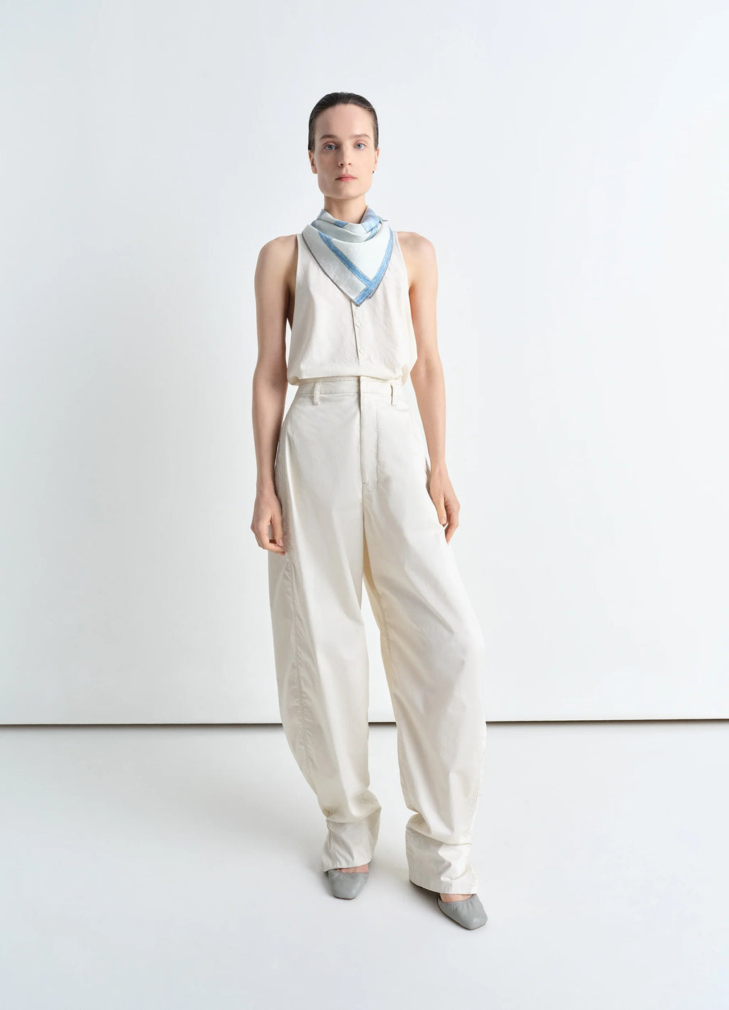 Philippe weisbecker silk square in silk blue chair print, model shot, full body view worn as bandana