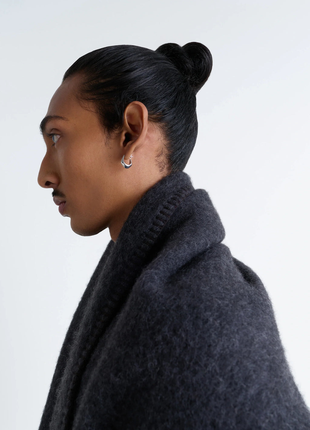 Lemaire maxi fluffy cocotte in fluffy alpaca, model shot, profile view wrapped around neck