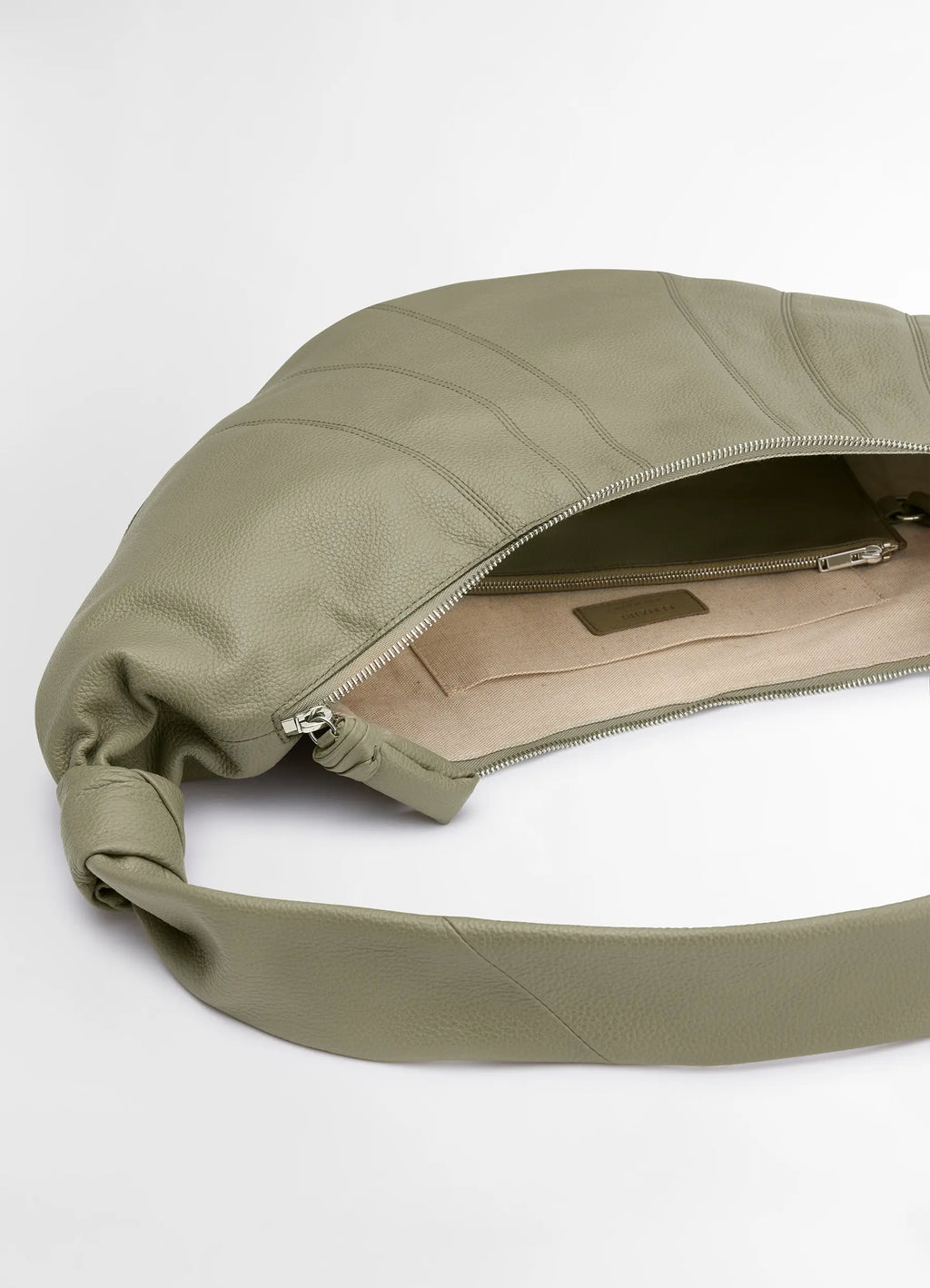 Lemaire large croissant bag in soft grained leather, product shot, top interior view open zipper spacious interior