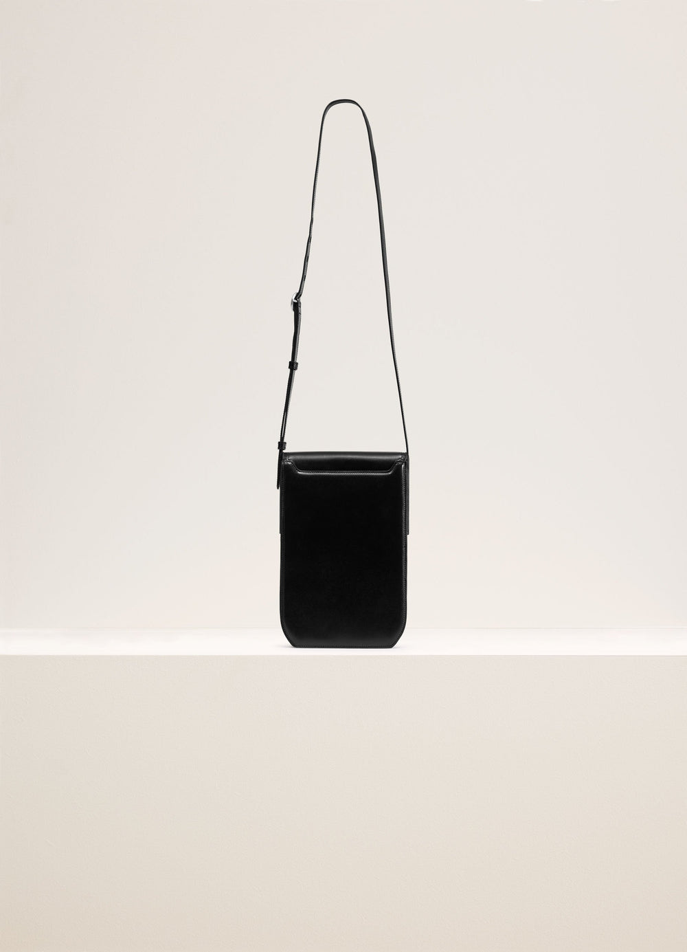 Lemaire Calepin Bag in Black Box Calfskin Leather, product shot, Front view Vertical format, adjustable strap