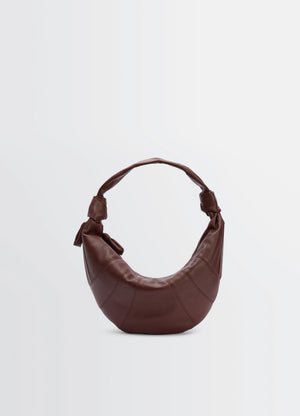 Fortune croissant bag in grained leather, product shot, front view arched shape