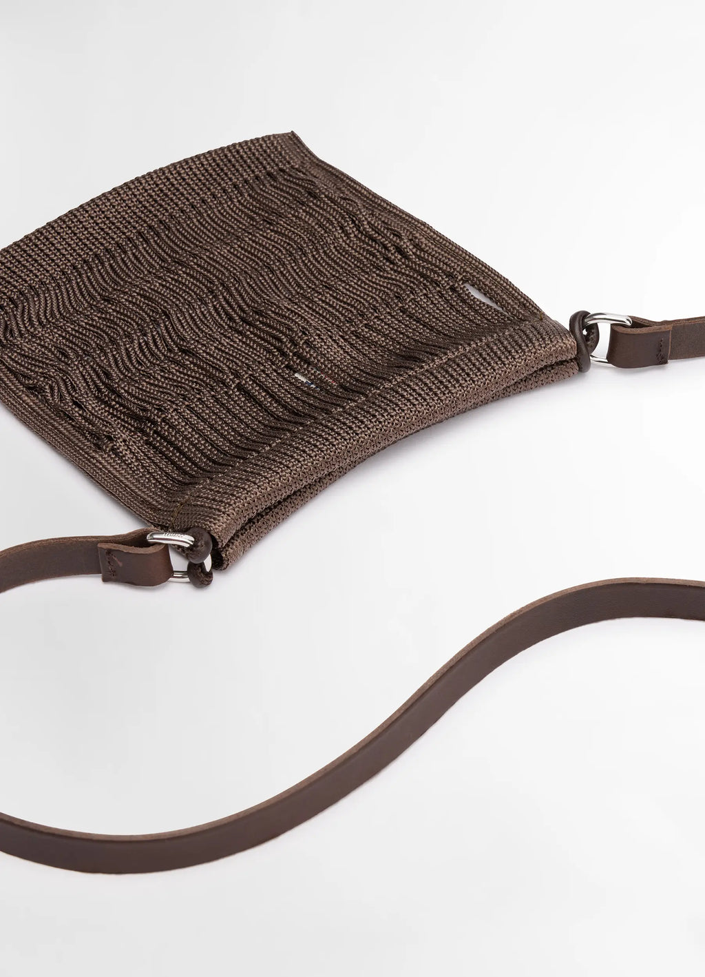 Lemaire mini crossbody filt net bag in dark chocolate nylon and leather, product shot, detail shot of stra woven net texture
