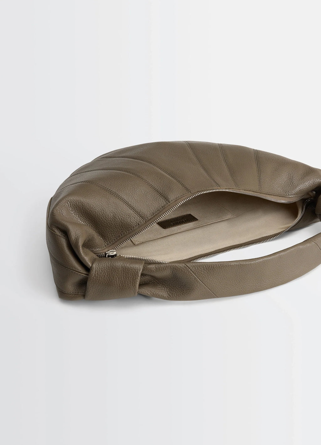 Mini fortune croissant bag in grained leather, product shot, top view zippered opening