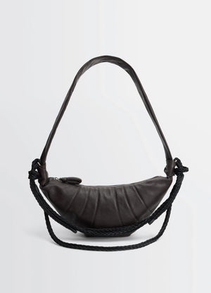 Lemaire braid medium croissant bag in grained buffalo leather, product shot, front view topstitched panels