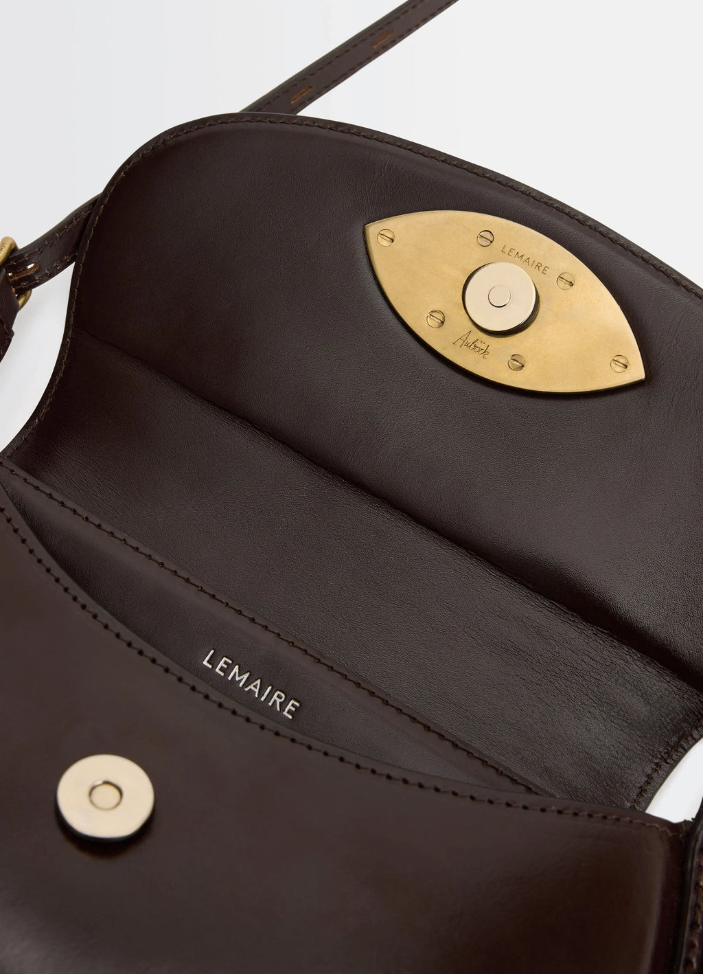 Aubock eye bag in brown leather, product shot, interior detail shot eye-shaped gold clasp