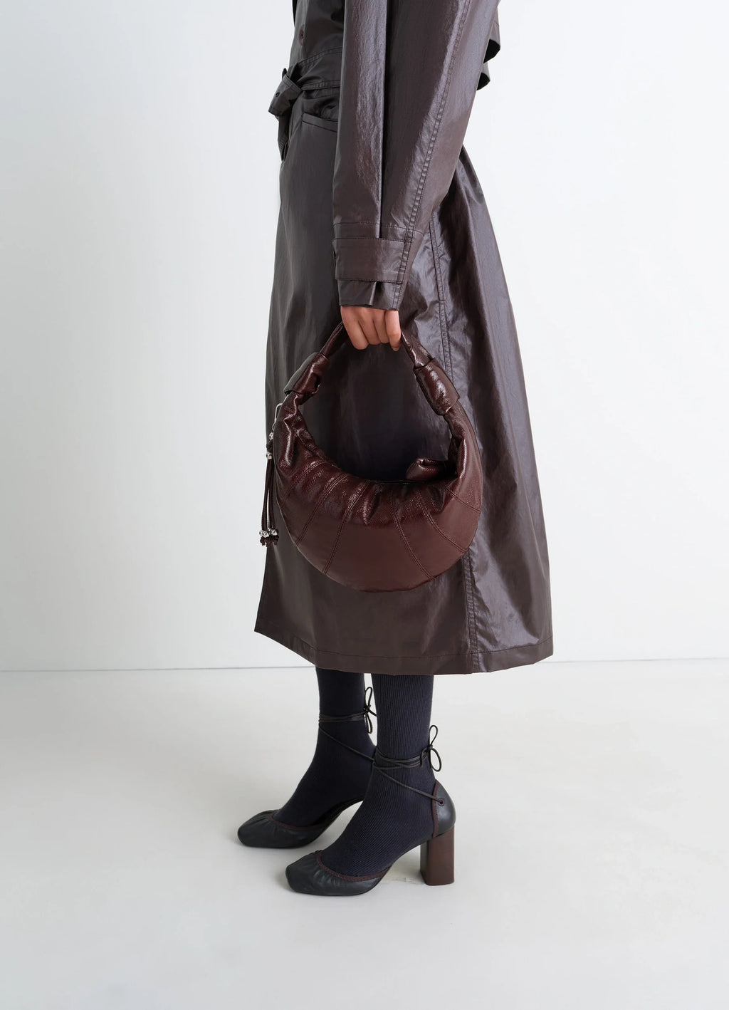 Mini fortune croissant in coated cotton canvas, model shot, side view knotted elements