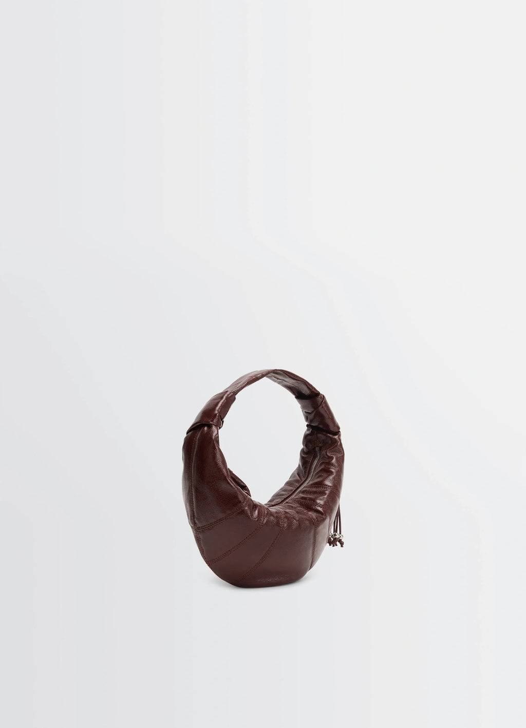 Mini fortune croissant in coated cotton canvas, product shot, three-quarter view curved handle, glossy texture