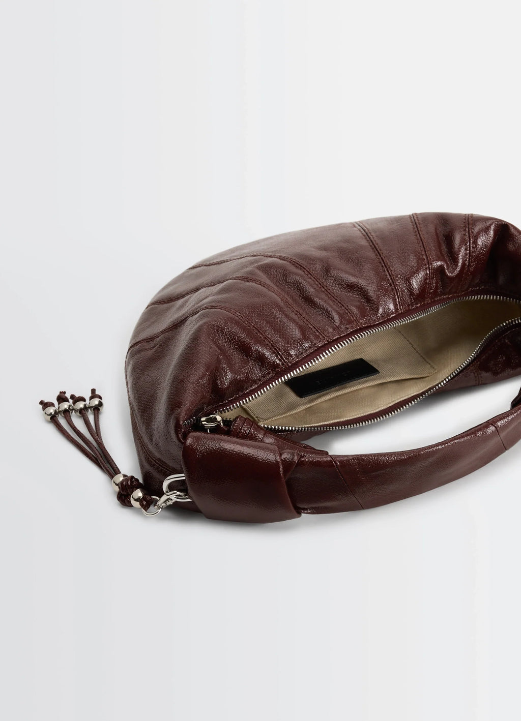 Mini fortune croissant in coated cotton canvas, product shot, top interior view visible zipper pocket