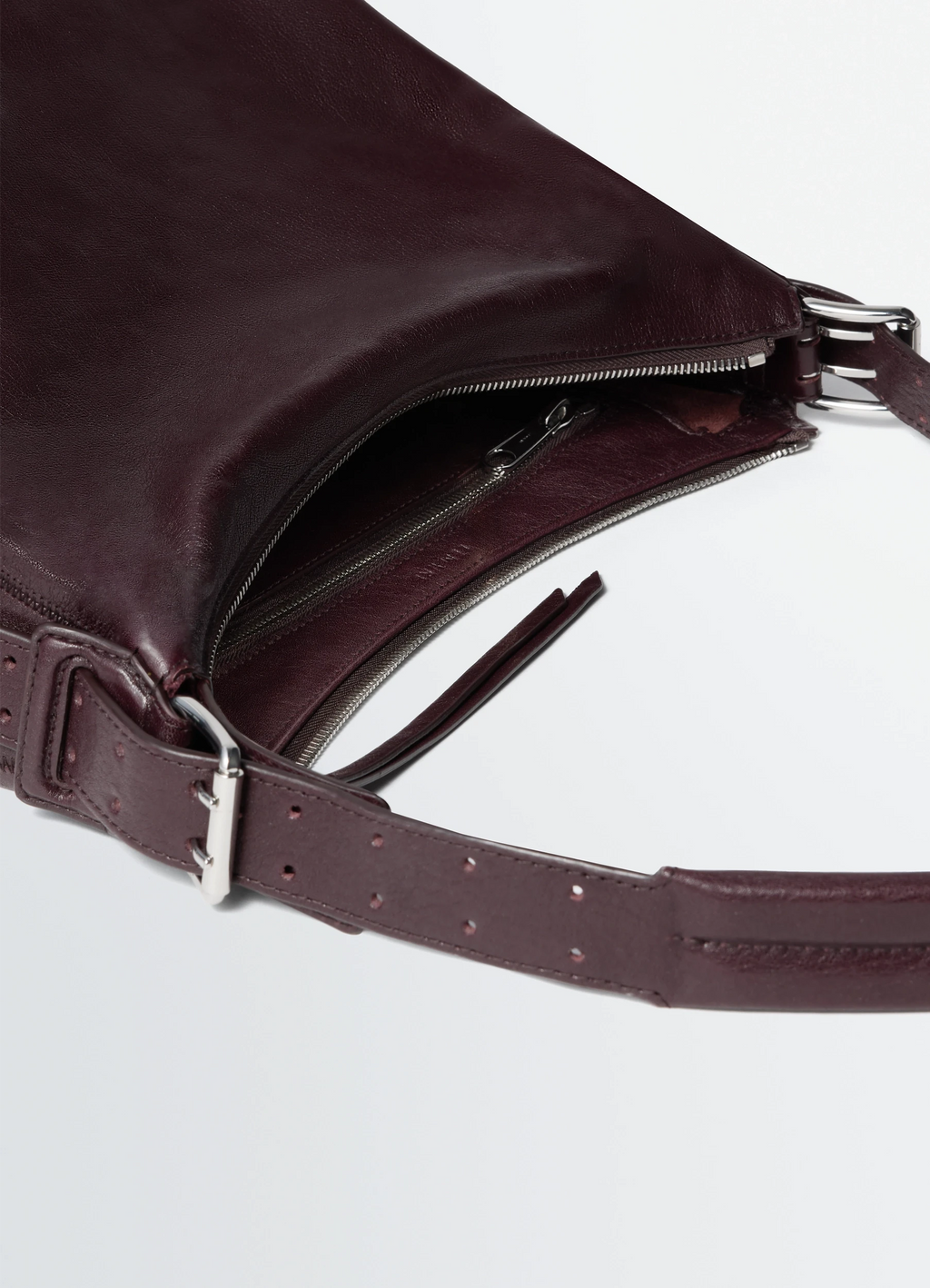 Small belted hobo bag in leather