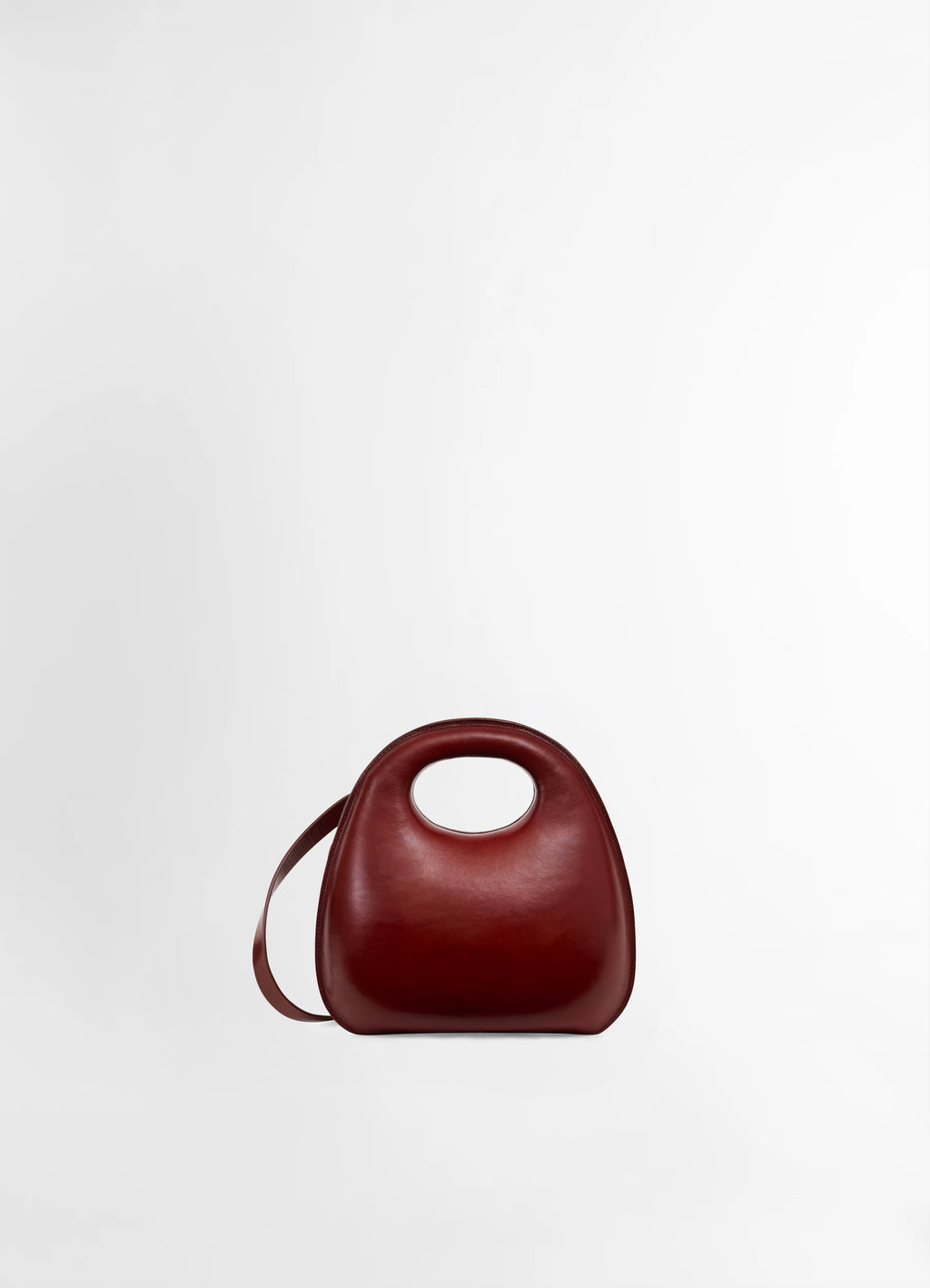 Lemaire egg bag in smooth vegetable-tanned cowhide, product shot, front view organic shape