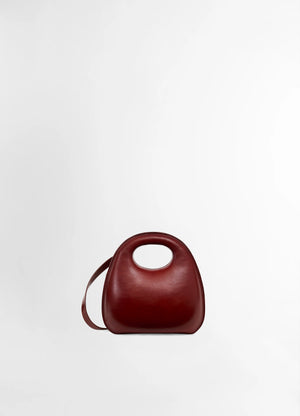 Lemaire egg bag in smooth vegetable-tanned cowhide, product shot, front view organic shape