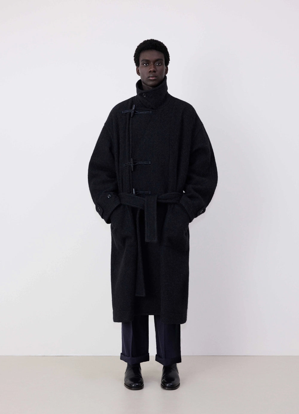 Lemaire Oversized Short Duffle Coat in Dark Wool and Alpaca Mix, model shot, Front view Belted oversized fit