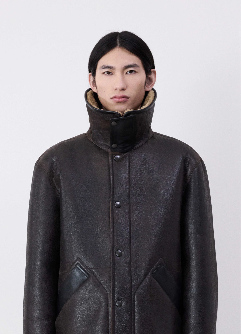 Lemaire shearling coat in heavy lamb shearling, model shot, close-up front view high collar detail