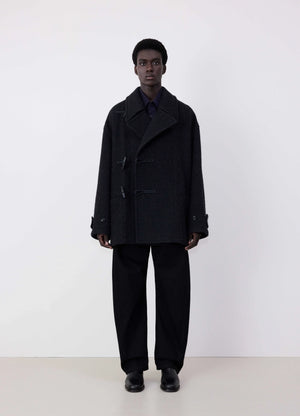 Lemaire short duffle coat in black wool and alpaca mix, model shot, front view boxy silhouette, three toggle