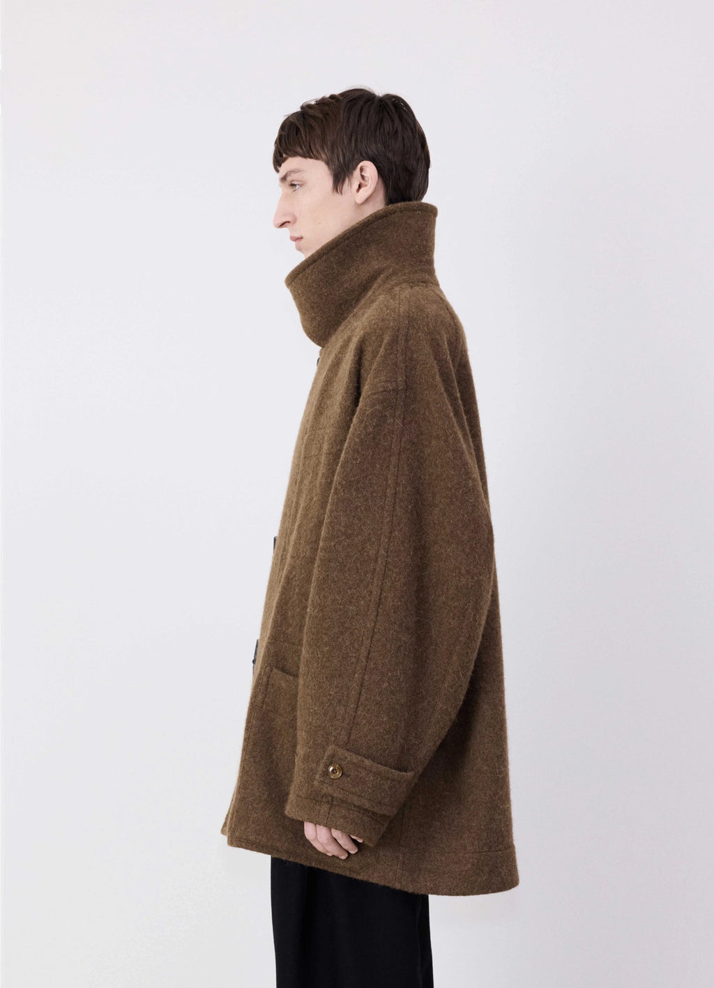 Lemaire short duffle coat in brown wool alpaca mix, model shot, side view high collar buttoned