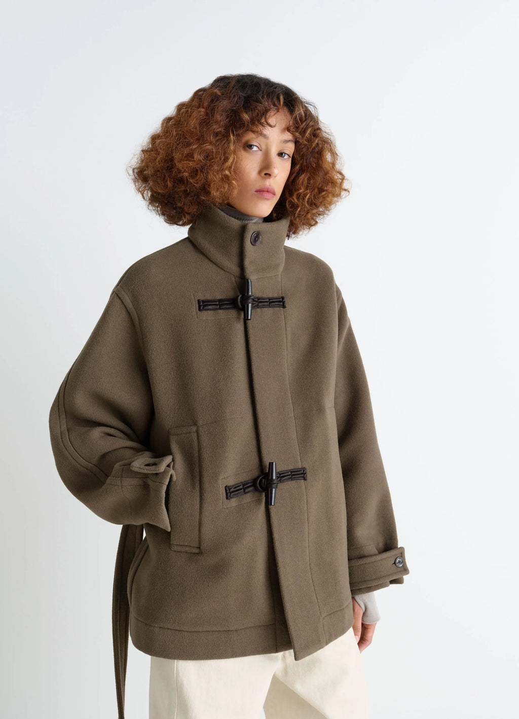 Lemaire short duffle coat in olive double-faced wool, model shot, front view utilitarian toggle details