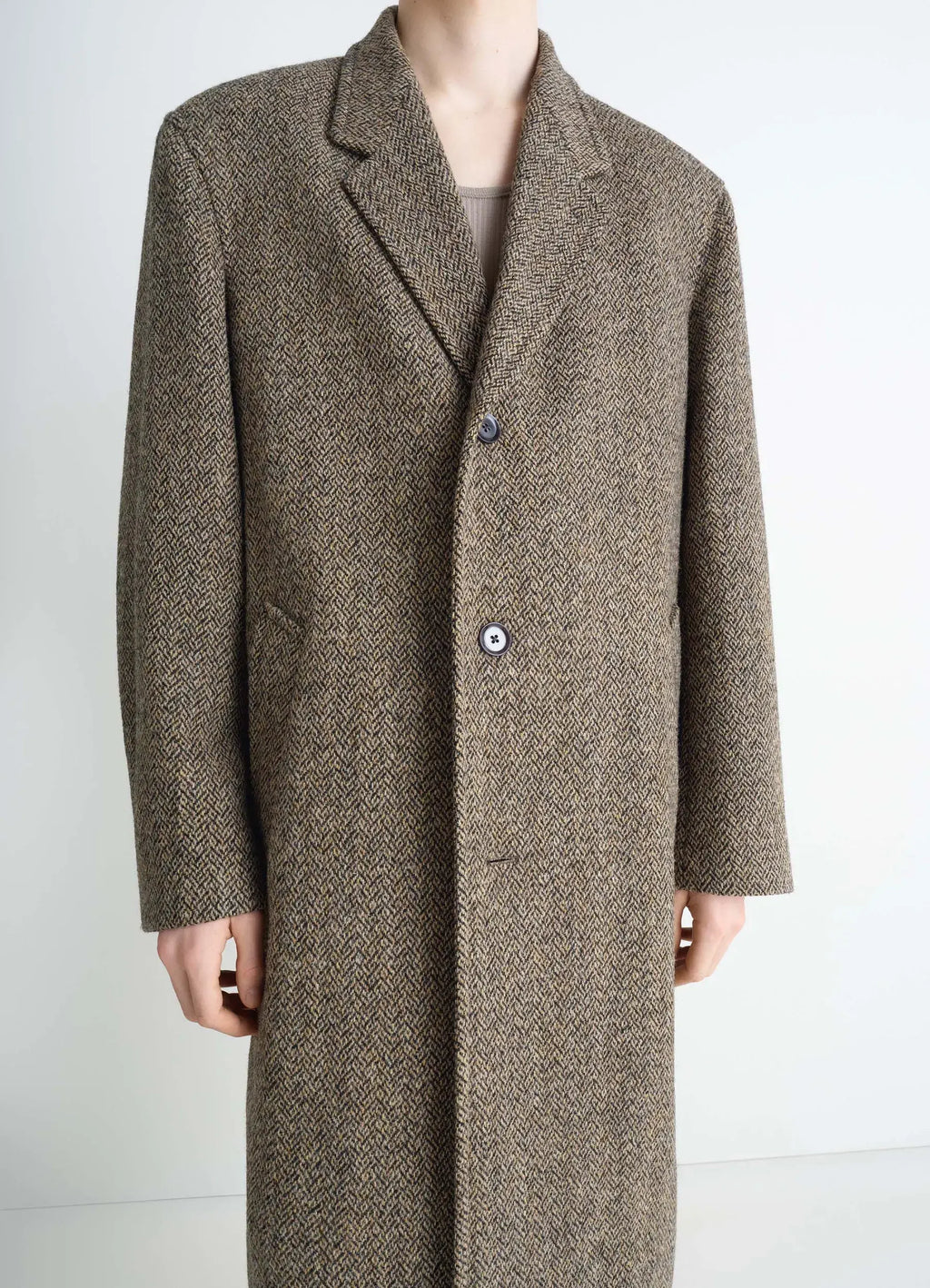 Chesterfield coat in herringbone harris tweed, model shot, close-up upper body buttoned closure detail