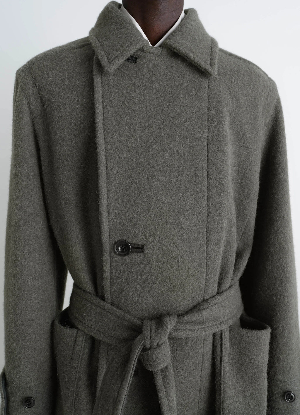 Lemaire soft coat in wool and alpaca blend, model shot, upper body front detail belted knot detail