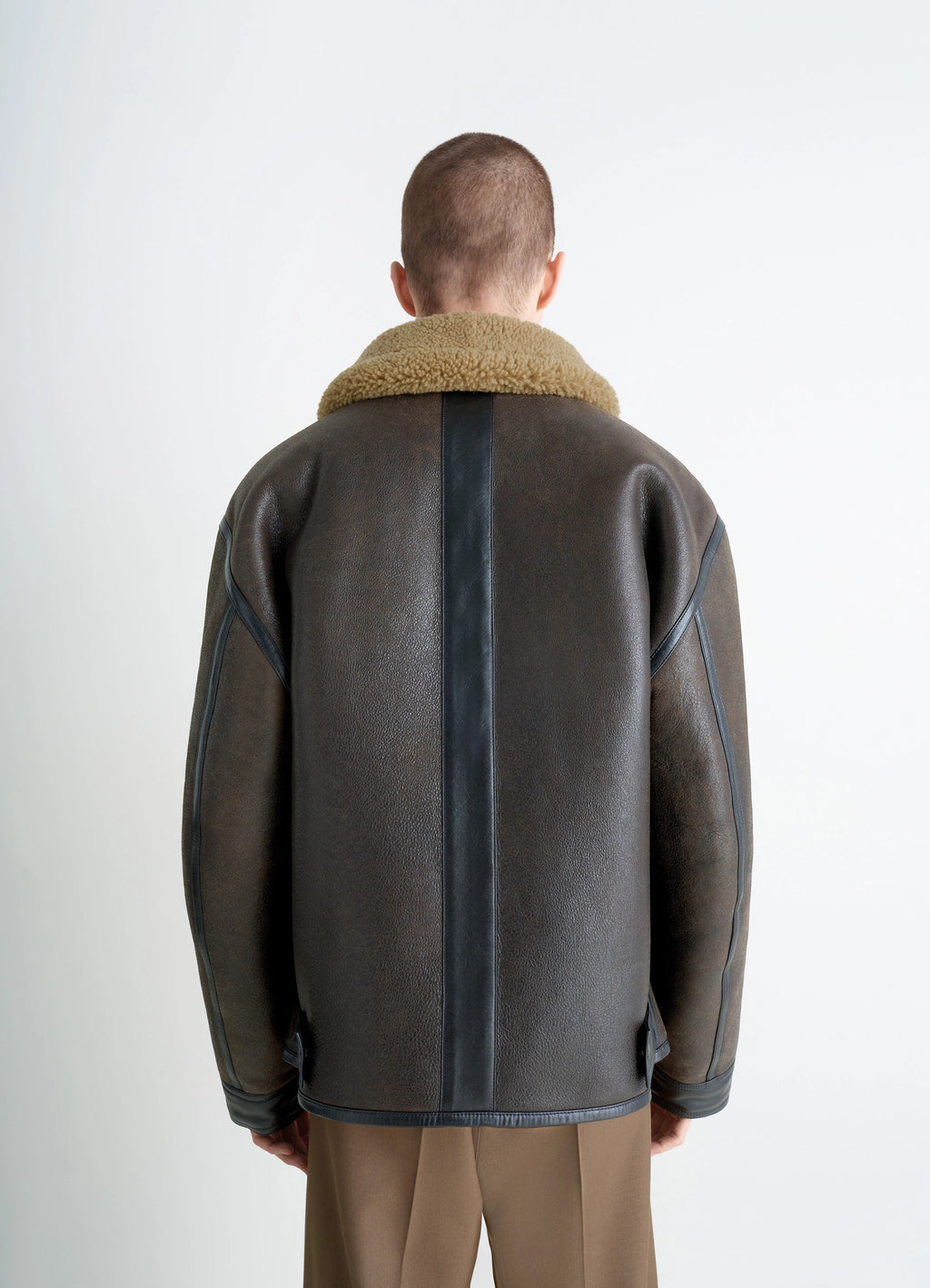 Shearling coat in contrasting leather trim, model shot, back view full-length rear shot