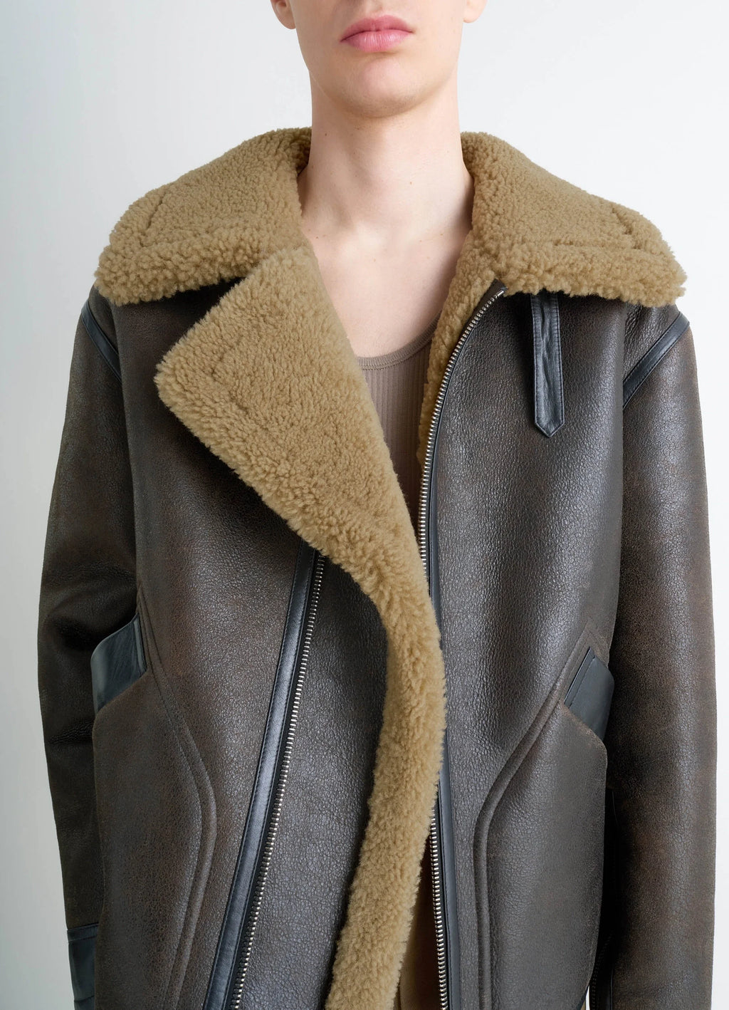 Shearling coat in contrasting leather trim, model shot, mid-length front view open collar ensemble