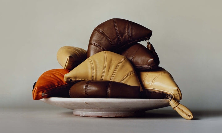 Leather pouch in Brown and beige leather, product shot, Front side view Curved shape