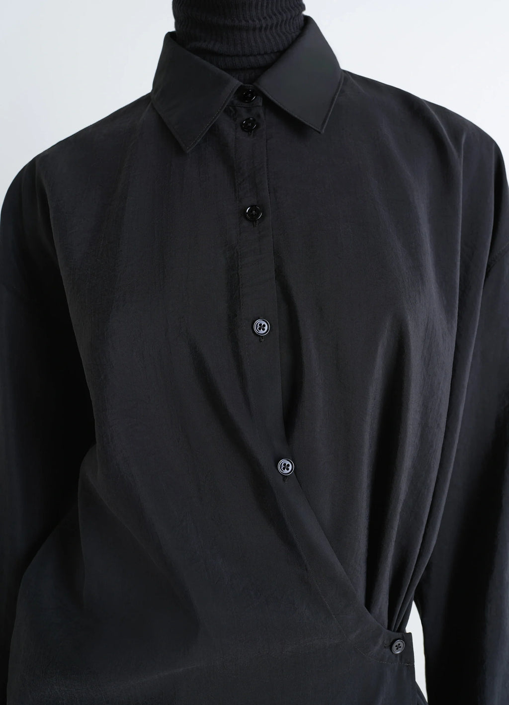 Lemaire straight collar twisted dre in black dry silk blend, model shot, detail shot twisted button design