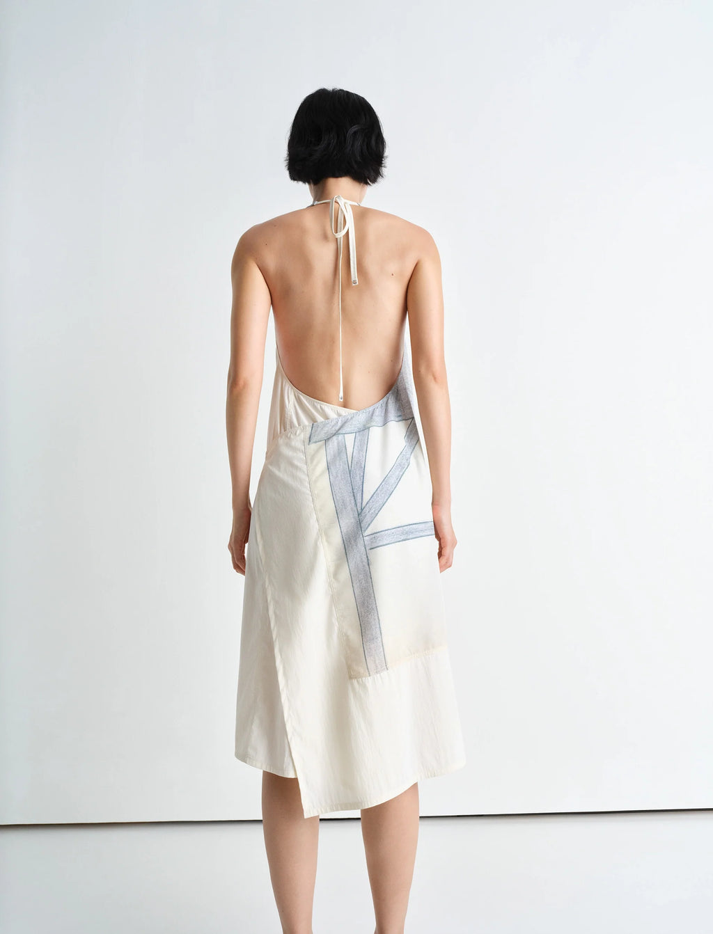 Philippe weisbecker apron dress in printed viscose technical lyocell, model shot, back view open back with tie straps