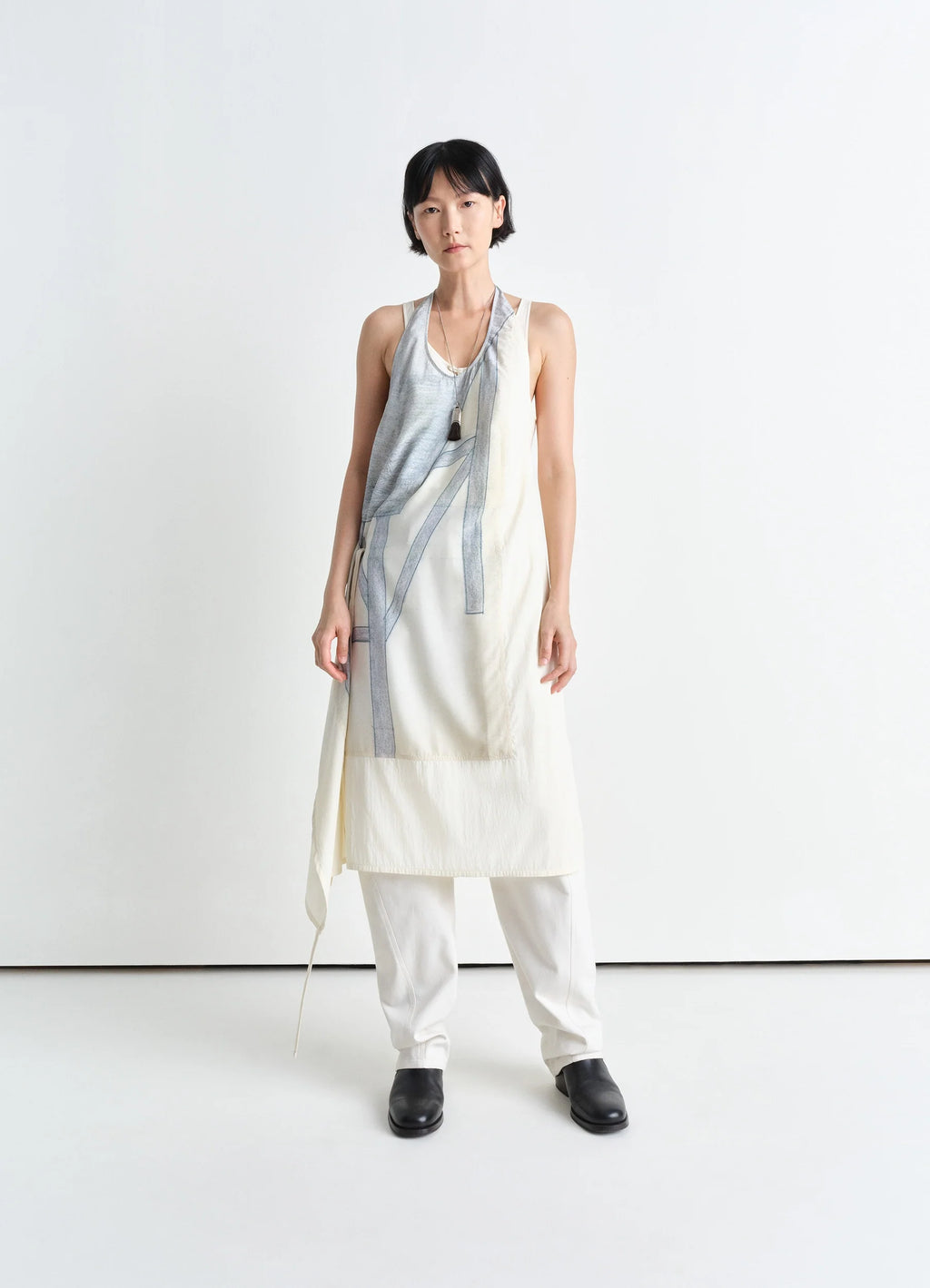 Philippe weisbecker apron dress in printed viscose technical lyocell, model shot, 3/4 front view asymmetric hem, layered styl