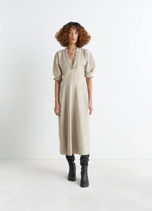 Leather v-neck dress in nubuck leather, model shot, front view fitted mid-length