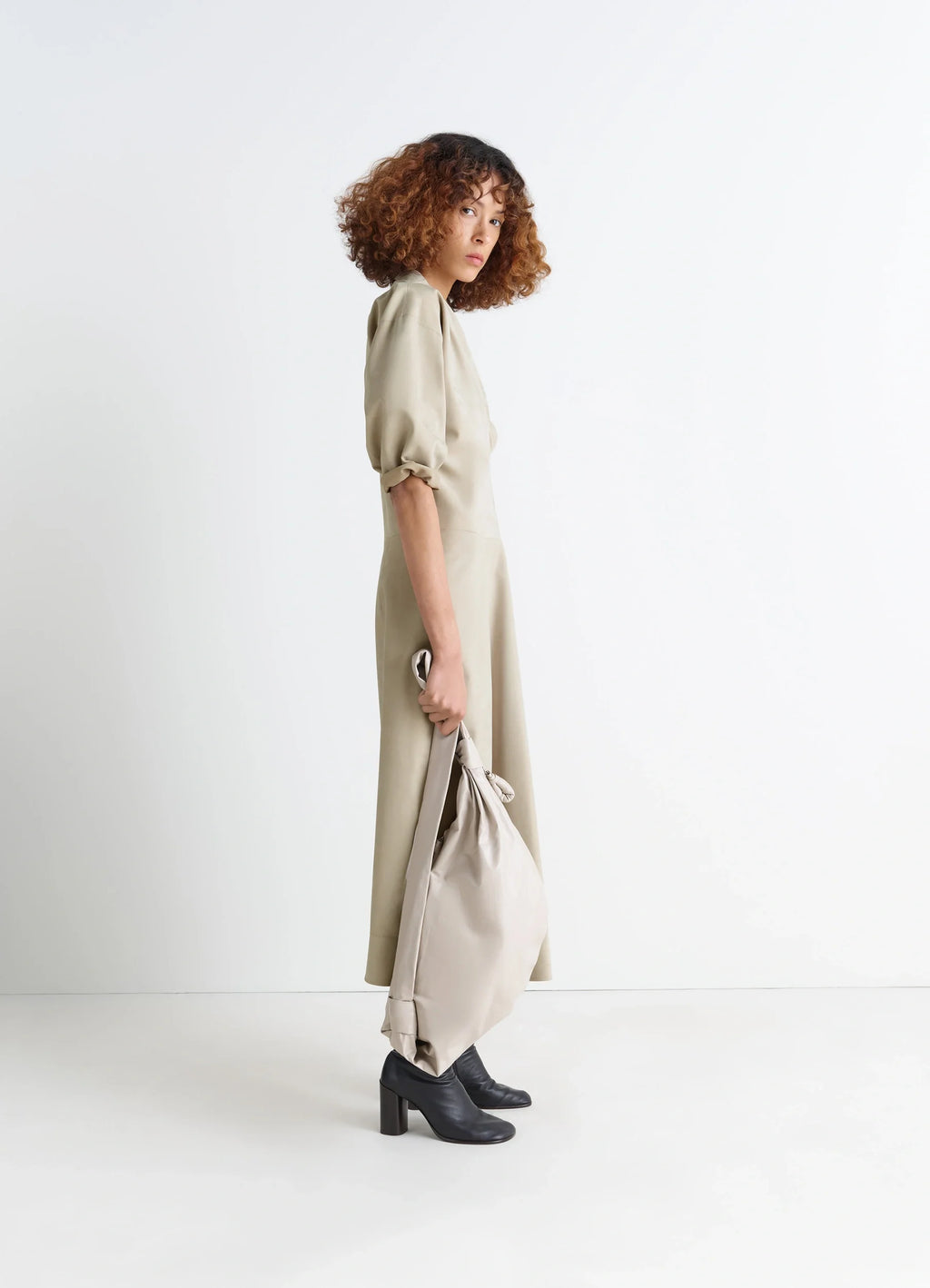 Leather v-neck dress in nubuck leather, model shot, side view short sleeves, loose fit