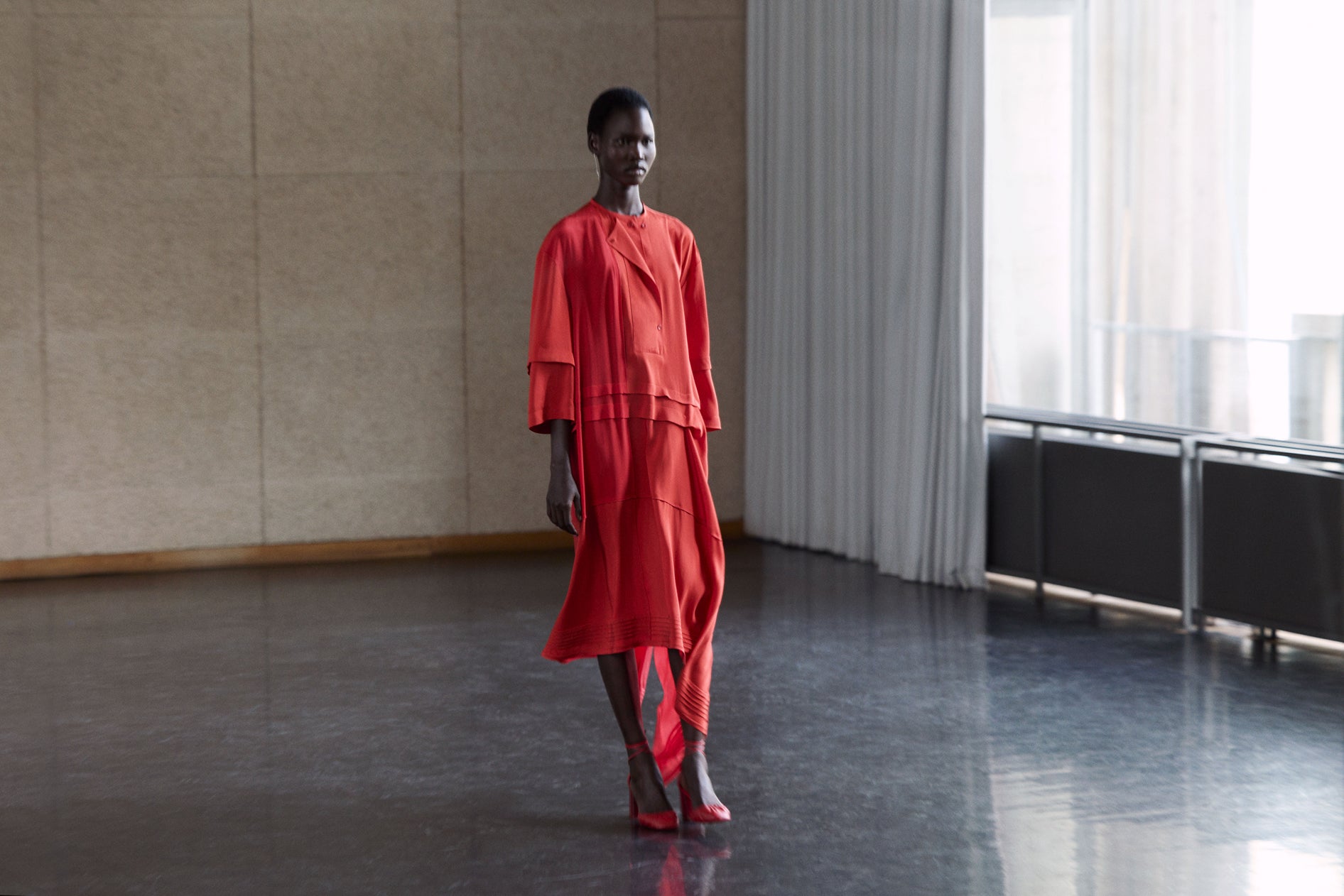 Red dress with jacket in red fabric, model shot, worn by model layered, loose fit