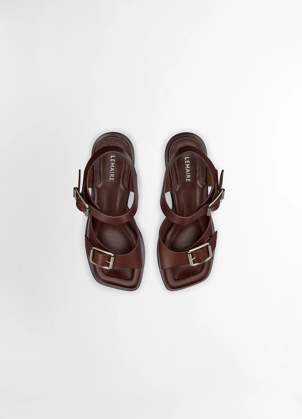 Lemaire square heeled sandals in smooth vegetable-tanned leather, product shot, direct overhead view visible double buckle st