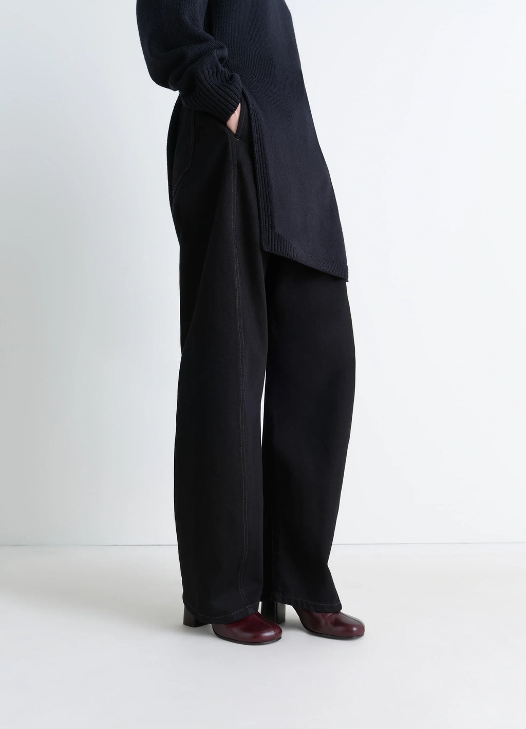 Anatomic boots 80 in glossy vegetable-tanned leather, model shot, bottom view wide leg pant overlay