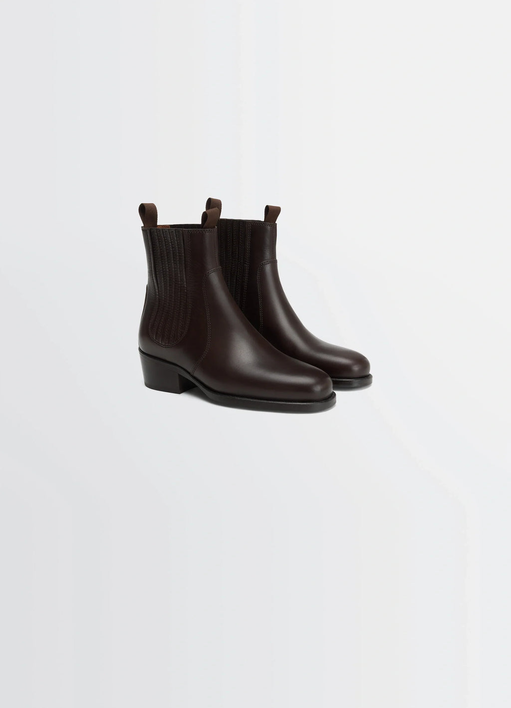 Chelsea boots in vegetable-tanned leather, product shot, three-quarter view ribbed elastic side