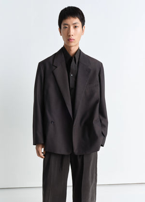 Lemaire soft double breasted jacket in tropical poly-wool mélange twill, model shot, front view structured shoulders, large l