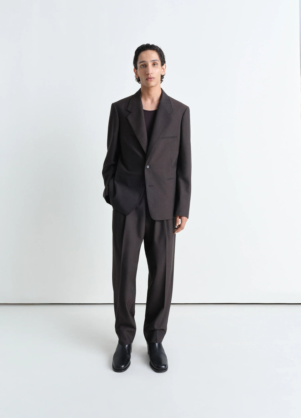 Lemaire tailored single breasted ja in mélange twill poly-wool, model shot, full body angle straight fit with button closure