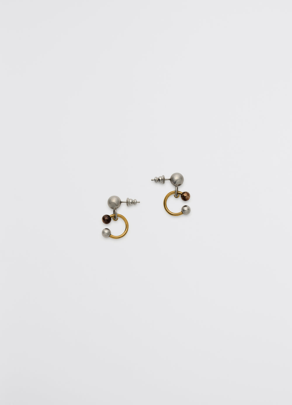 LEMAIRE Rattle Earrings in Silver, Copper, Gold Brass, product shot, Top down view Sculpted with shiny finish
