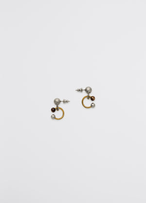 Lemaire rattle earrings in silver, copper, gold brass, product shot, top down view sculpted with shiny finish