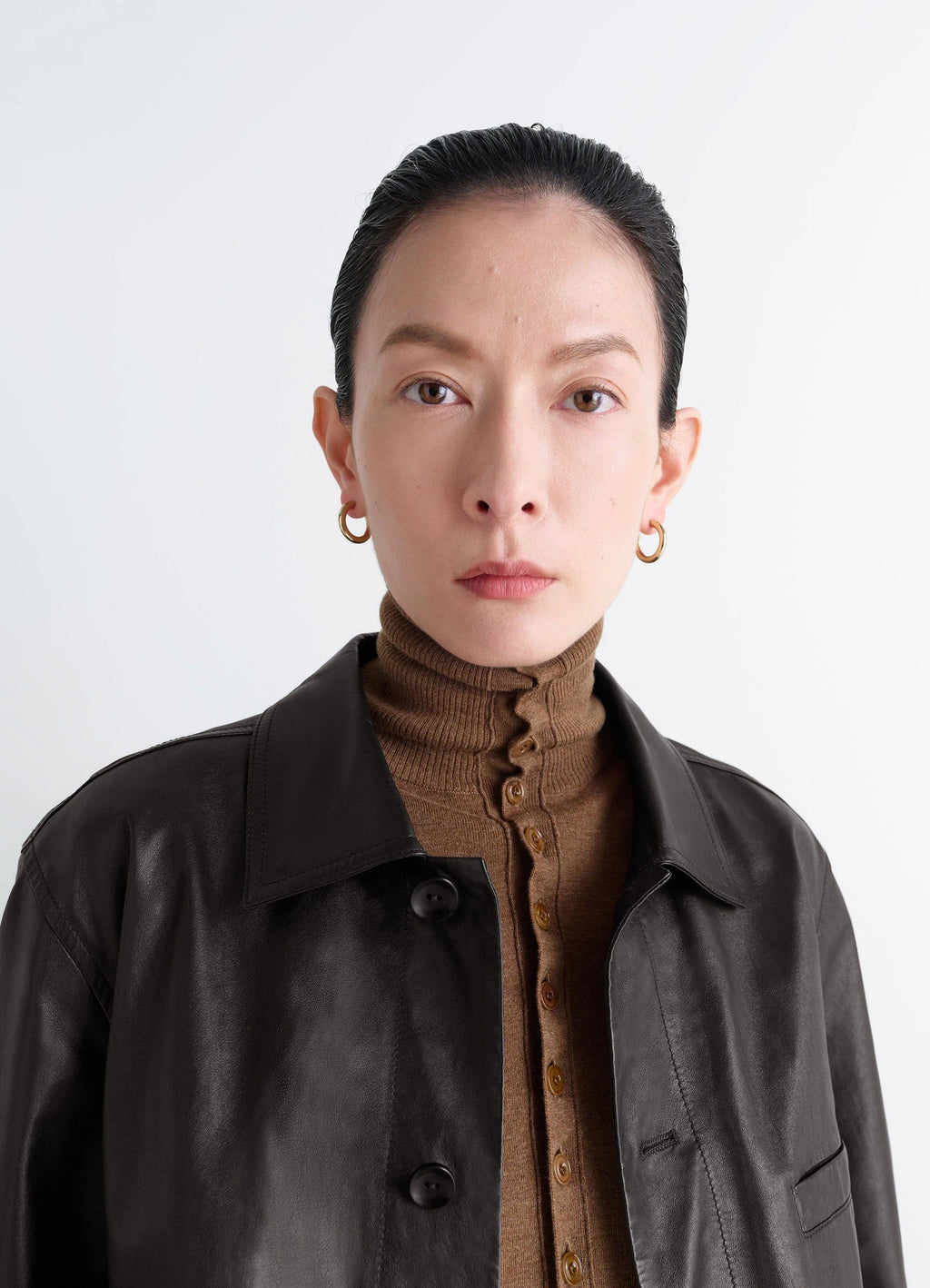 Classic hoops s in recycled gold-plated silver, model shot, side profile view medium hoop earrings