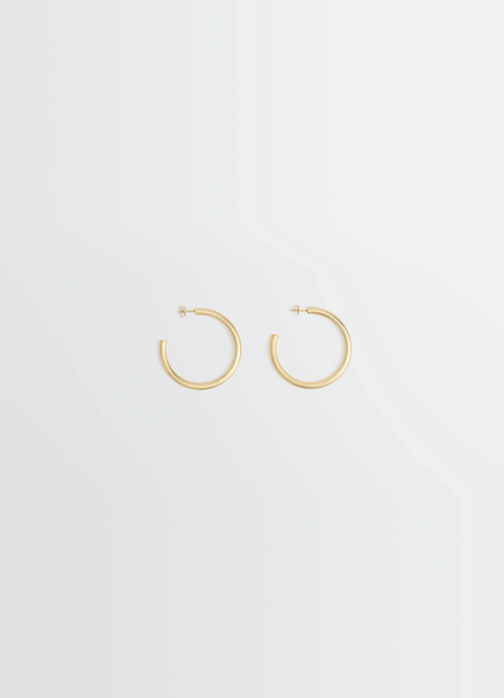 Classic hoops m in recycled gold-plated silver, product shot, front view minimalist design