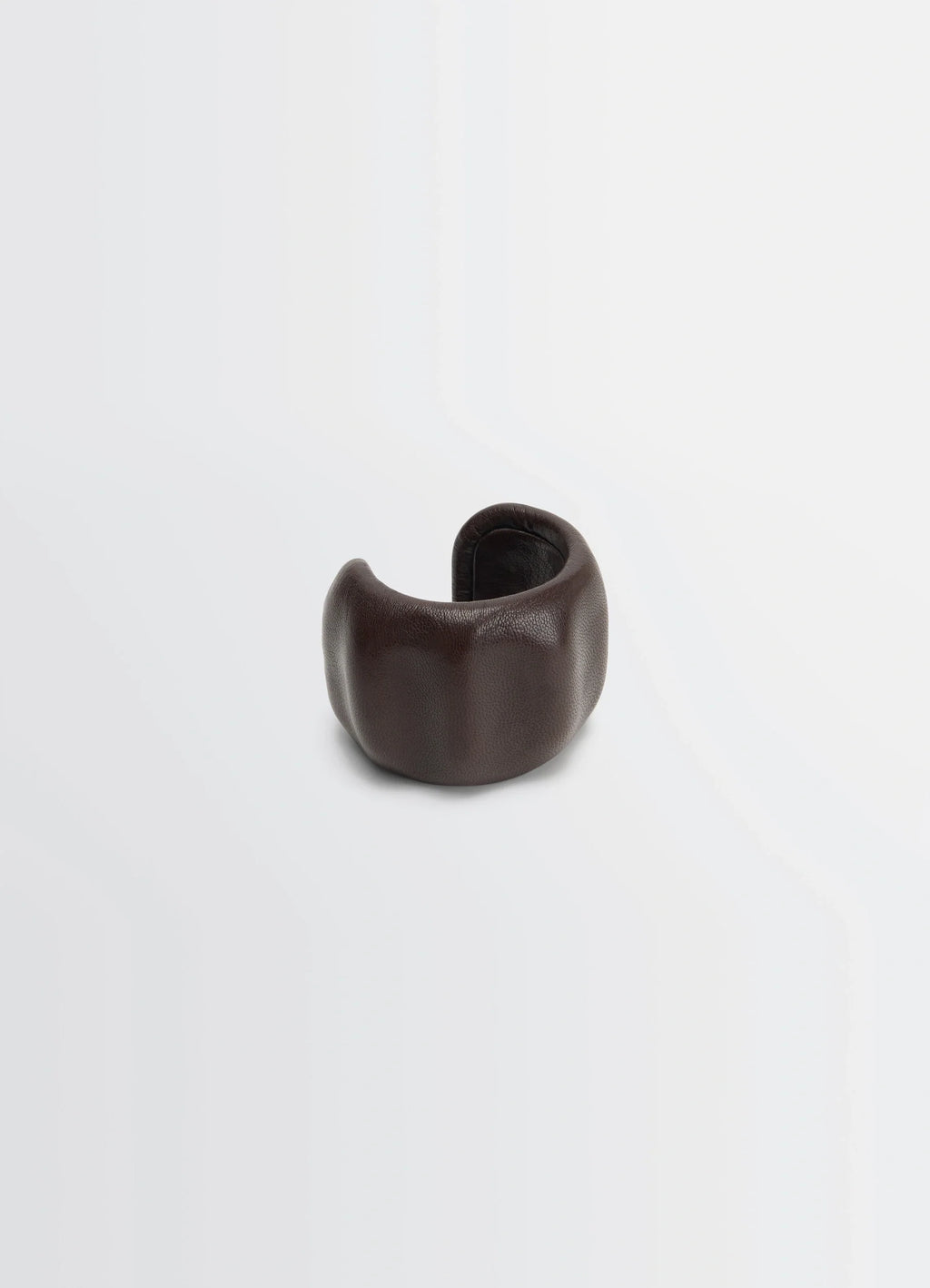Lemaire carlos cuff in brown goats leather, product shot, angled side view molded organic form