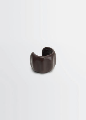 Lemaire carlos cuff in brown goats leather, product shot, angled side view molded organic form