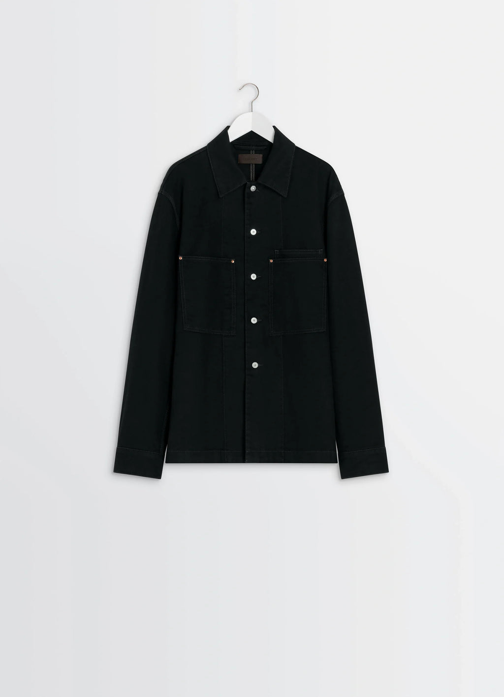 Lemaire workwear overshirt in deep black medium-weight denim, product shot, side view hanging long sleeves visible