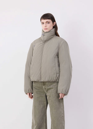 Lemaire short puffer blouson in light cotton blend, model shot, front side angle rounded silhouette