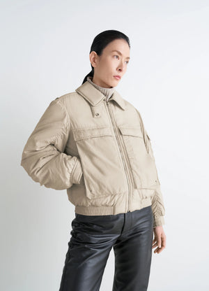 Lemaire short bomber in beige lightweight nylon, model shot, side view removable collar, gusseted pockets