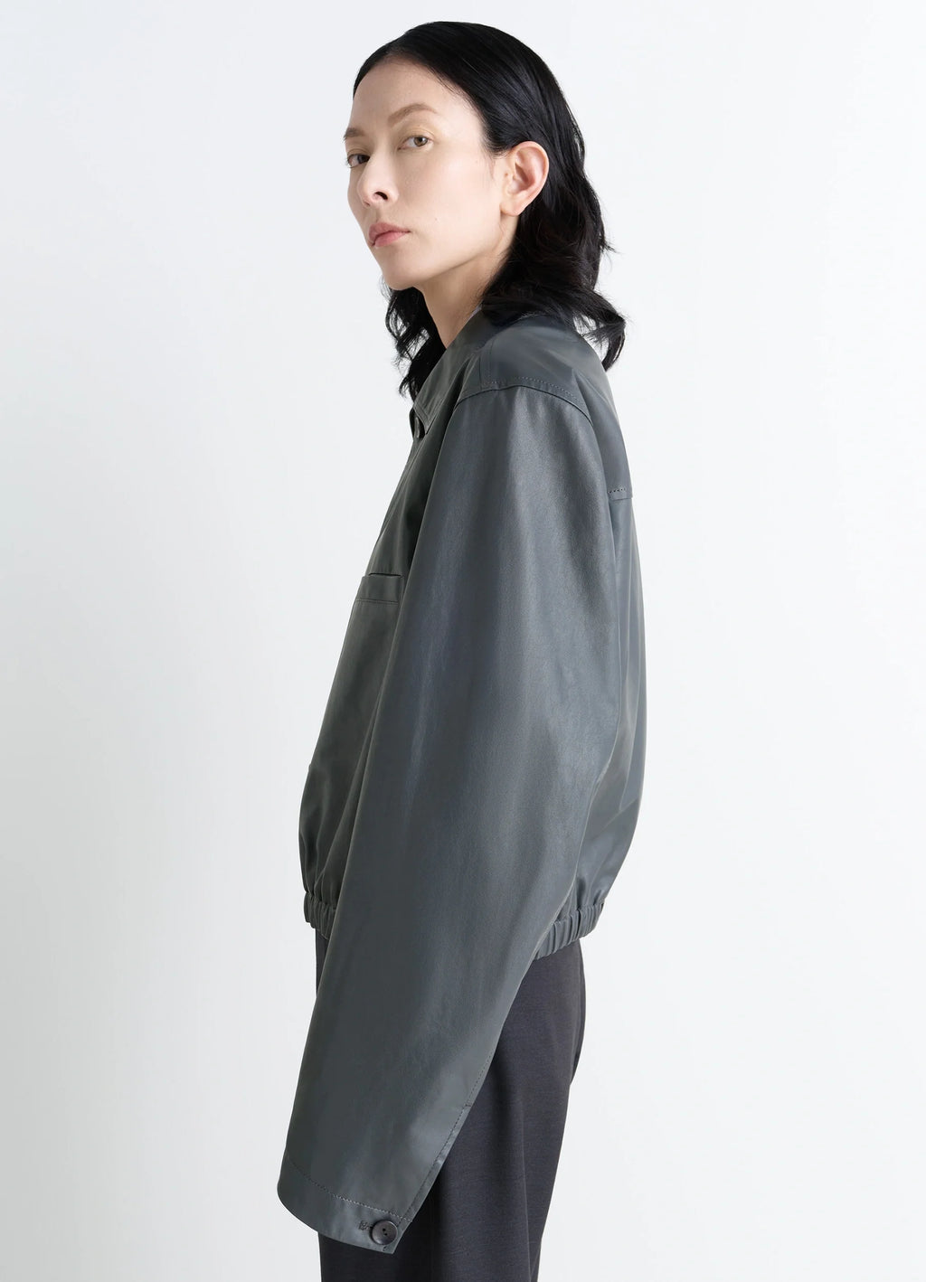 Lemaire soft leather blouson in soft cow leather, model shot, side profile long sleeves, elasticated hem