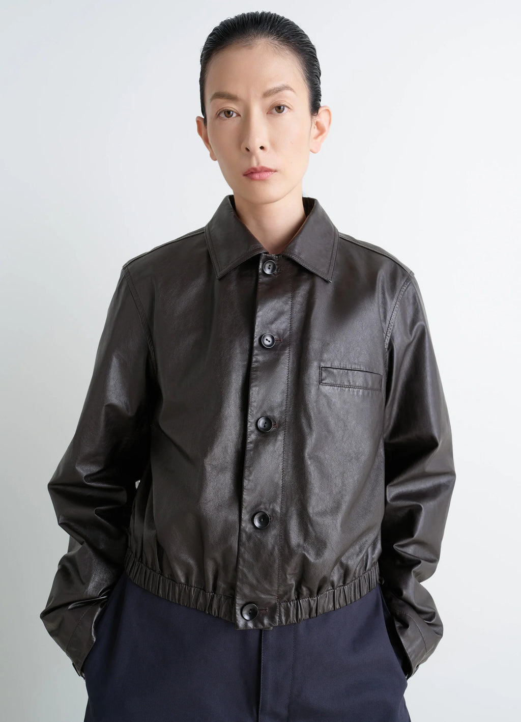 Lemaire soft leather blouson in soft cow leather, model shot, front view cropped, elastic hem