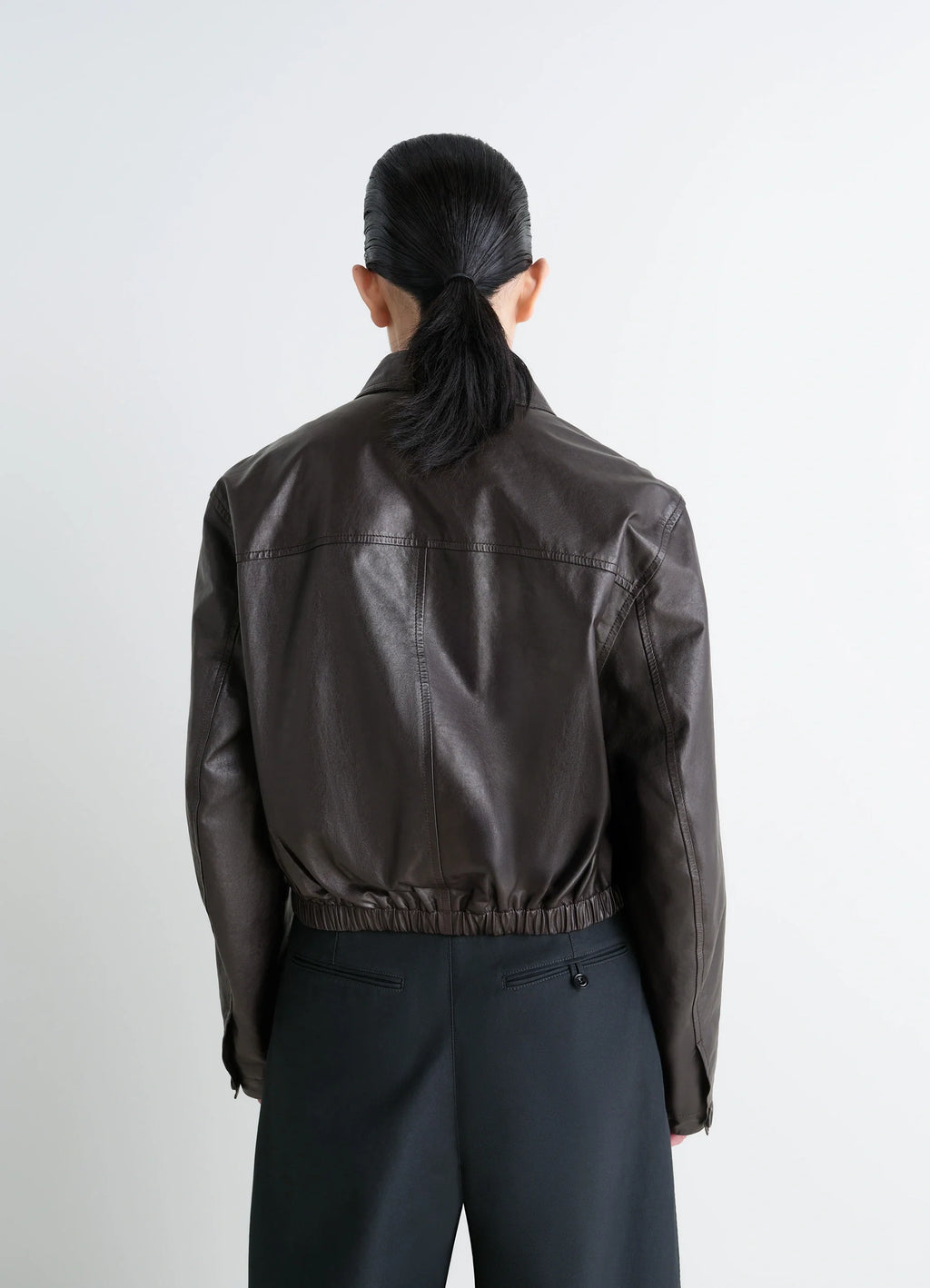 Lemaire soft leather blouson in soft cow leather, model shot, back view elastic hem, spread collar