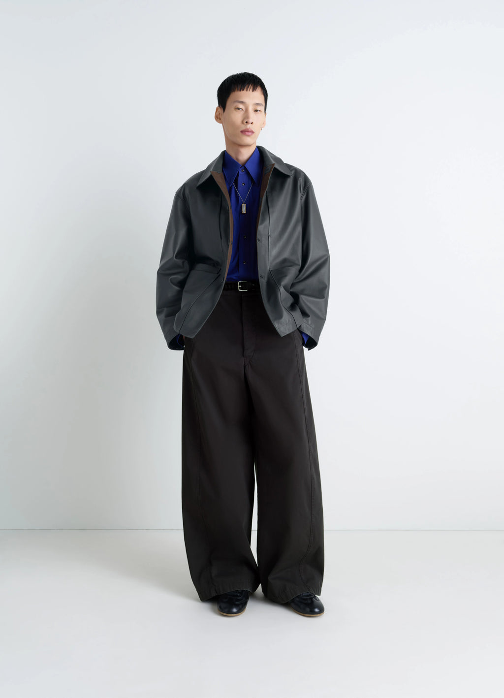 Lemaire leather workwear jacket in thick cow leather, grained, model shot, three-quarter view lightly oversized fit